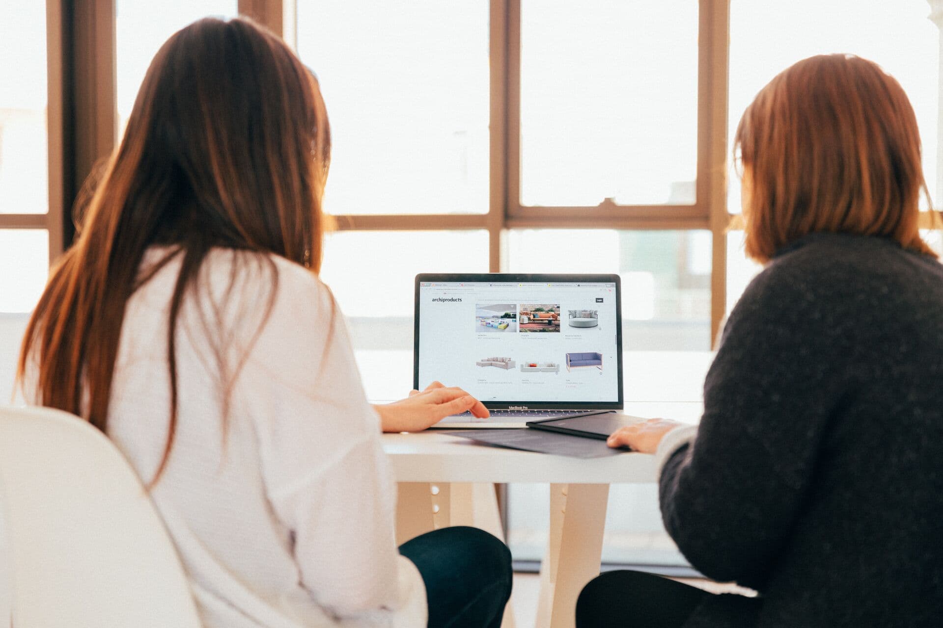 Reviewing product work on a laptop